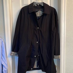 Burberry Black, Nova check trench coat with wool liner but no hood.